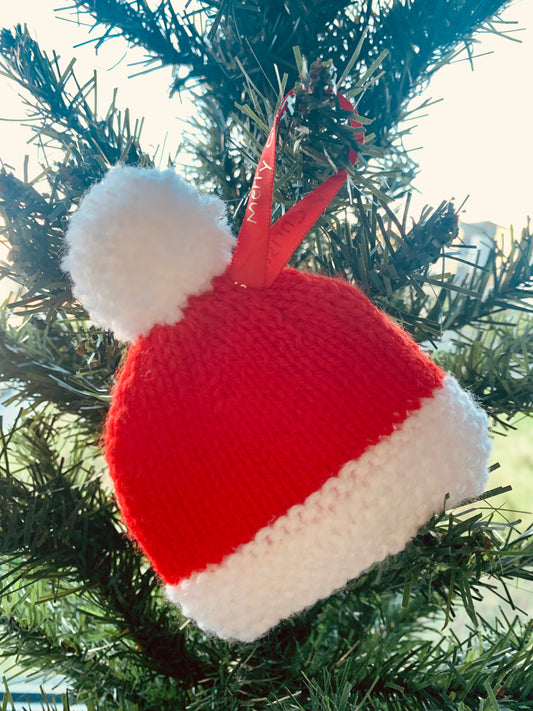 Hand knitted Santa hat with Christmas ribbon