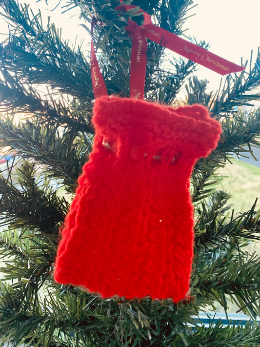 Hand knitted red drawstring bag with Christmas ribbon